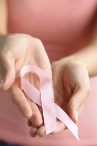 breast cancer ribbon in hands